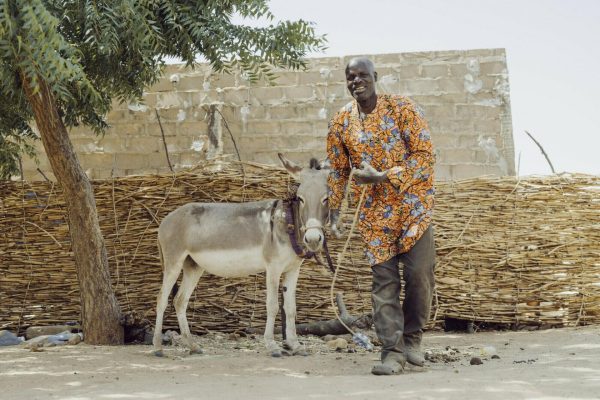 Houré Abdou (wife) and Dan Doura (husband) and their daughters. 

Houre had symptoms of leprosy age six. She went to a traditional healer. Her dream was to be a civil servant, but she says that leprosy changed everything. She tried to find a cure, her symptoms reduced for a time, then they came back on her wedding. This led to a divorce. She found Danja clinic and finally got treatment.

Dan discovered symptoms of leprosy in 1983, his wife left him when she found out he had leprosy. He remained caring for his four children and they settled near Danja. They found a welcoming community here and found it much easier to be located nearby for his ongoing care. 

Dan and Houre found mutual acceptance and understanding in one another, and got married. Their daughters do not have leprosy and there is no stigma. Houre says that despite leprosy changing everything, she feels a great peace in her family. Dan and Houre participate in awareness campaigns and want young people to get tested and for them to avoid going to traditional healers. They want to be an example for others and be living proof of the physical effects of leprosy. 

They have benefitted from The Leprosy Mission Niger’s involvement: a latrine, goats, a donkey and school fees for their daughters.